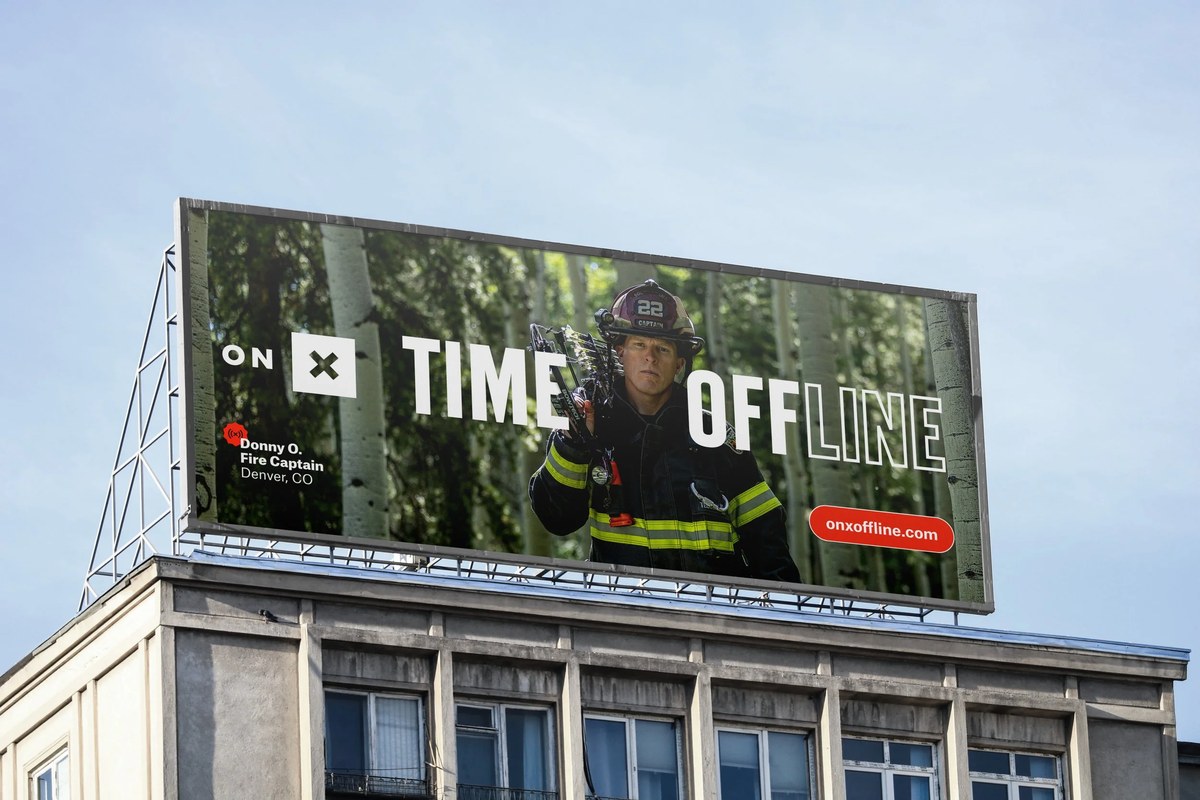 Time Off[Line] rooftop billboard featuring a Denver fire captain
